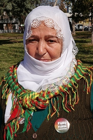 A Kurdish woman is seen wearing a badge on her lapel that reads “Kurd, Kurdish, Kurdistan.” In the city of Diyarbakir in Turkey, hundreds of people participated in a march and press conference led by the Democratic Institutions Platform, demanding that the Kurdish language to be officially recognized and used as a language of education. The demonstration organized for International Mother Language Day on February 21 was also supported by the Peoples' Equality and Democracy Party (DEM Party) and the Democratic Regions Party (DBP).