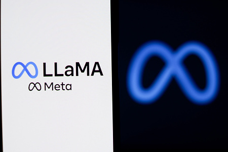 In this photo illustration, the LLaMA Meta AI logo seen displayed on a smartphone and in the background.