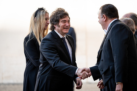 The President of the Republic of Argentina, Javier Milei (C), and his sister General Secretary of the Presidency of the Argentine Nation, Karina Milei (back) are welcomed by the Vatican Gentlemen at San Damaso courtyard in the Vatican.
