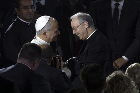Pope Leo XIV greets maestro Marco Frisina at the end of the Christmas “Concert with the Poor” in the Paul VI Hall at the Vatican.