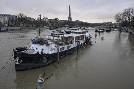 A barge boat seen on the high water level of river Seine.
Due to days of heavy rain the water level of the river Seine in Paris has risen to the level that is flooding the lower grounds of the city.