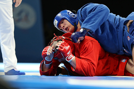 Artur Savkin from Russia (winner, in blue) and Rustam Aubov from Russia (in red) seen in action during the Combat Sambo - 98kg. discipline at the 2026 Sambo Founders Cup in International Sambo and Boxing Center. International Moscow Sambo Founders Cup is held in memory and respect for the founders of sambo sports. Before 2022 tournament was known as Anatoly Kharlampiev's Cup. The 2026 event brings together over 100 athletes from more than 10 countries.