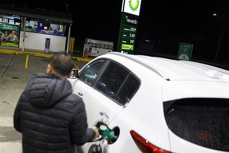 A man seen filling his car with fuel at a fuel station. One month into the United States Iran conflict, the country is experiencing rising fuel prices, supply disruptions, and increased cost of living pressures. Ongoing instability in global oil markets has led to shortages at some service stations and higher transport and grocery costs highlighting the continuing economic impact of the war.