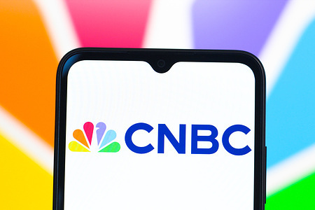 In this photo illustration, the CNBC logo is seen displayed on a smartphone screen.