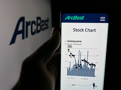 In this photo illustration, a smartphone with the web page of US logistics company ArcBest Corporation is seen on screen in front of logo.