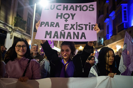 A protester holds a placard against gender violence during a demonstration marking the International Day for the Elimination of Violence against Women. Dozens of female protesters take to the streets of Malaga to denounce the femicides and abusers in a nationwide movement every 25th of November.