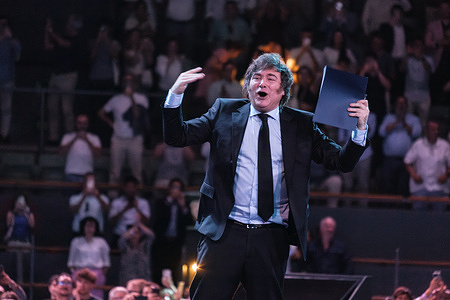 The president of Argentina Javier Milei gestures while giving a speech during the conference at the Madrid Economic Forum at the Palacio de Vista Alegre in Madrid.