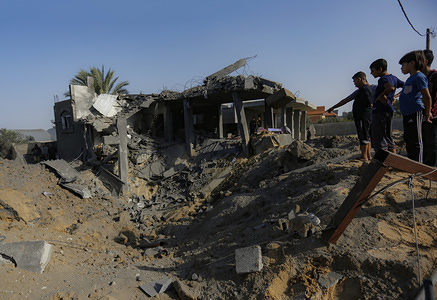 Palestinians inspect a house destroyed in an Israeli air strike in the southern Gaza Strip.
Tension is rising in Gaza after the Al-Quds Brigades commander, the armed wing of Gaza based resistance faction Islamic Jihad, Bahaa Abu Al-Atta died in an Israeli airstrike.