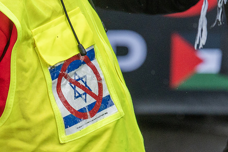 A detail on a Pro-Palestine protestor’s high-vis jacket during a Pro-Palestine march across the Sydney Harbour Bridge. Protesters in Sydney and Melbourne joined marches and actions globally, as pressure mounts on the Israeli government over a devastating humanitarian crisis unfolding as its war against Hamas continues.