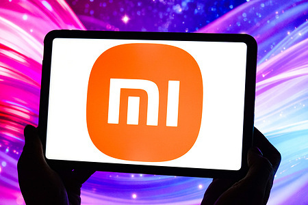 In this photo illustration, the Xiaomi logo is displayed on the screen of a tablet.