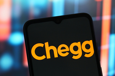 In this photo illustration, the Chegg logo is seen displayed on a smartphone screen.