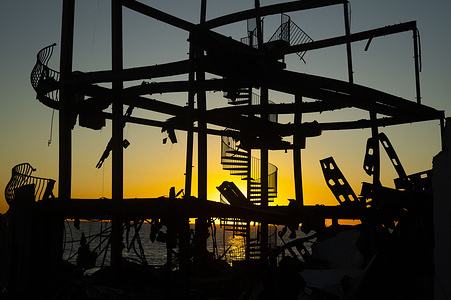 Damaged structures are seen after the Palisades Fire burnt along Pacific Coast Highway.