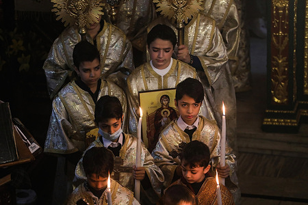 Palestinian worshippers from the Greek Orthodox community pray during Christmas Eve Mass at St. Porphyrios Church.The majority of orthodox believers celebrate Christmas on January 7. The churches in Romania, Bulgaria, Cyprus and Greece mark it on December 25 along with other Christian denominations.