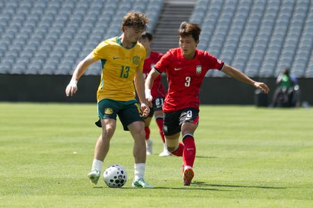 James Overy (L) of Australia football team and Shin Ilyeon (R) of Korea Republic football team seen in action during the U23 International Friendlies match between Australia and Korea Republic held at polytec Stadium. Final score; Australia 2:2 Korea Republic.