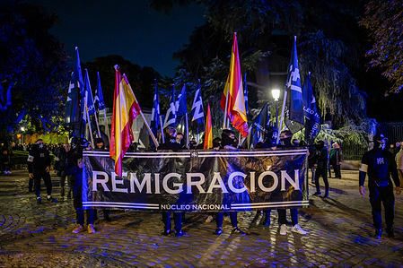 Protesters hold a banner saying "Remigracion" during the demonstration. During a far-right demonstration in the streets of Madrid, organized by the radical far-right group National Nucleus, which demands more aid for Spaniards, expulsion of immigrants, and greater control at the borders, the protest ended with arrests and police charges.