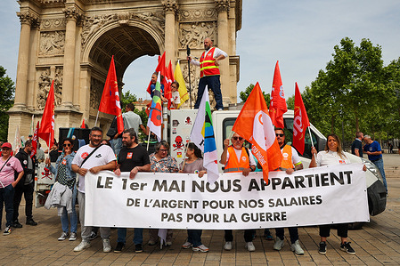 Demonstrators hold a banner at the end of the May Day demonstration. During the traditional May Day parade organized by unions for International Workers' Day, thousands of people marched through the streets of Marseille.