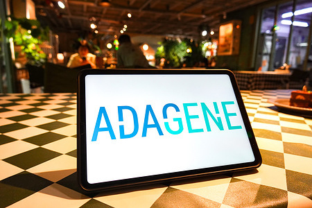 In this photo illustration, the Adagene logo is displayed on the screen of a tablet.