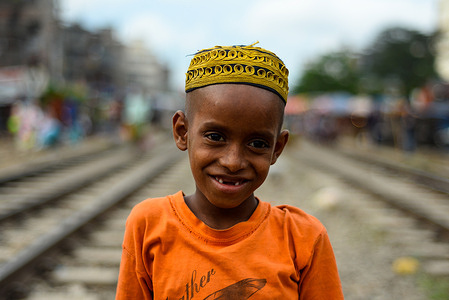 Md Ismail (5), a resident of the slum beside the Tejgaon rail line, he is a student of Madrasa, he plays over the rail line since they don't have a sports field.