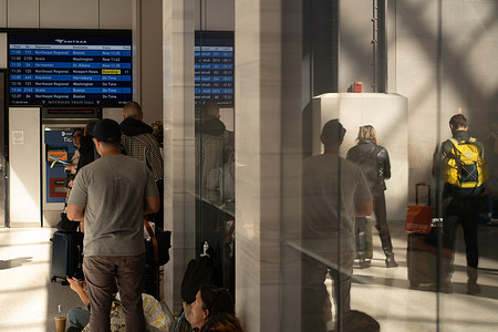 Commuters in Moynahan Train Hall before Zohran Mamdani's, Democratic Candidate for Mayor of New York City, press conference calling out President Donald Trump freezing $18 billion to New York City infrastructure projects at Hudson Yards. Mamdani would be joined at the MTA West Side Yard by Congressman Jerry Nadler, Assemblymember Tony Simone, and State Senator Hoylman-Sigal.