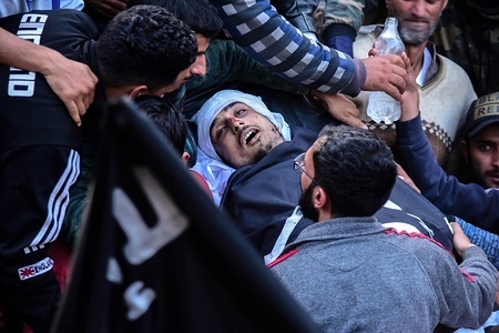 (EDITORS NOTE: Image depicts death.)
Kashmiri mourners are seen carrying the dead body of Faiz Mushtaq, a militant who was killed in an encounter.
Two militants, a policeman and a civilian were killed during a gun battle in Srinagar. The encounter started on Wednesday morning after government forces received intelligence input about the presence of militants. Dozens of civilians were injured.