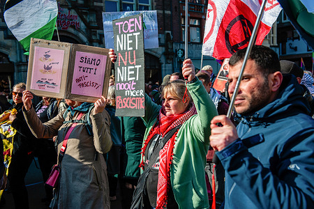 Protesters are marching while holding anti-fascist placards. People gathered at Dam Square in Amsterdam to call for diversity and solidarity and to stand against racism and discrimination, marking the International Day for the Elimination of Racial Discrimination. 
Throughout Europe and the US, people are demonstrating against policies that deport refugees and relegate Muslims to second-class citizens.