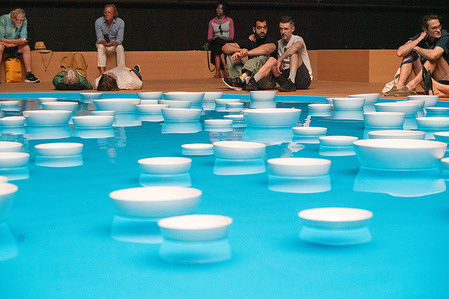 One of 3, 40 foot wide circular water basin filled with hundreds of porcelain bowls at the Clinamen show at the Park Avenue Armory in New York. The immersive sound and art installation was created by French artist Celeste Boursier-Mougenot and it will be open to public until August 9.