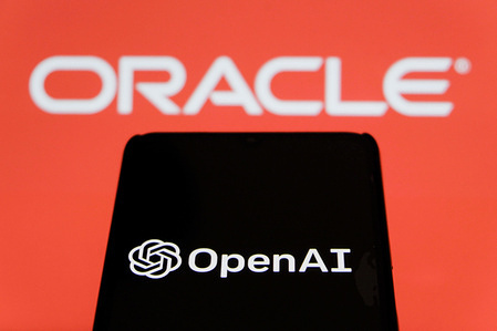 In this photo illustration, the OpenAI logo displayed on a smartphone with qn ORACLE logo in the background.