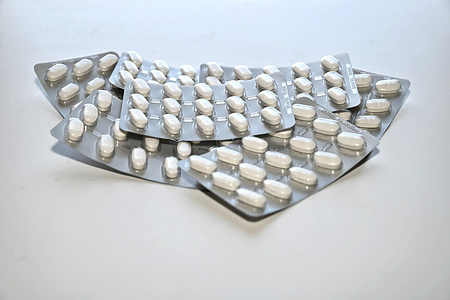 In this stock photo, blister packs containing magnesium tablets are seen displayed.