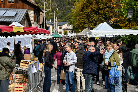 People stroll through the village streets, between the stalls of regional and artisanal products, during the 34th edition of the chestnut festival in La Bolline Valdeblore.