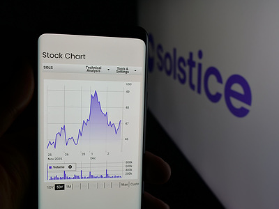 In this photo illustration, a person is holding a smartphone with the webpage of US company Solstice Advanced Materials Inc. on screen in front of logo.