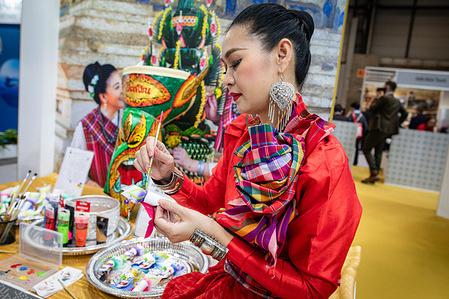 A representative of the Chinese delegation during the opening day of the 2024 edition of FITUR. The 44th edition of the Madrid International Tourism Fair (FITUR) opened its doors this Wednesday. With participation from 152 countries and 9,000 companies, Ifema hosts a showcase of travel proposals. The event is expected to draw over 200,000 attendees until its closure on Sunday, January 28.