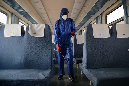 A worker at Nairobi Terminus fumigates a passenger train as a preventive measure against COVID-19.
Kenya on March 18, 2020 confirmed three more cases of Coronavirus, bringing the total number of those affected to seven.