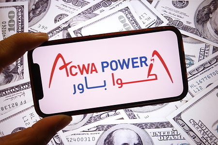 In this photo illustration, the Acwa Power Company logo is seen displayed on a smartphone screen.