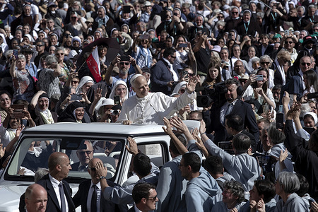 Pope Leo waves from the popemobile as he leaves at the end of a Mass for the Jubilee of Consecrated Life at St. Peter's square.