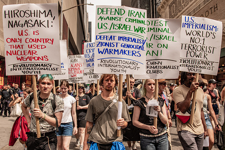 Protesters holding placards march in the city to protest against the recent bombings of Iranian nuclear facilities and civilian infrastructure. Hundreds have gathered to march and protest against the recent aerial bombardment of Iranian nuclear facilities in multiple locations around the country sparking fears of a wider regional conflict.