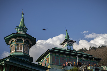 Muslim devotees gather outside the hilltop cave shrine of 15th-century Sufi saint Sakhi Zain-ud-din Wali in Aishmuqam village, 75 km (47 miles) south of Srinagar.