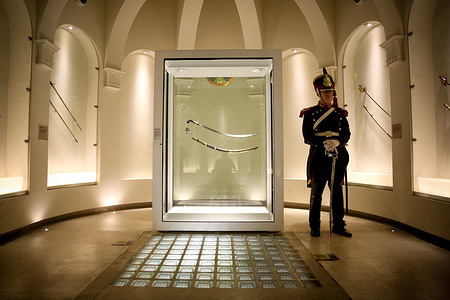 A grenadier guards San Martin's curved saber at the National Historical Museum. The curved saber of José de San Martín is the weapon used in combat by the Liberator of America, and as such, it possesses great iconographic value. This saber accompanied San Martín in the battles for South American independence.