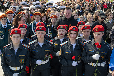 Members of children’s patriotic organizations lay flowers at the “Mother Motherland” monument at Piskaryovskoye Memorial Cemetery (one of the mass burial sites for victims of the Siege of Leningrad) during an event dedicated to the celebration of Victory Day.