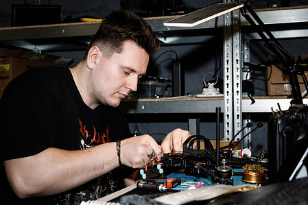 A technician repairs an electronic drone device at his workstation. Engineers of the 93rd Mechanized Brigade are seen working in a drone workshop assembling and repairing critical electronic components. As modern warfare evolves, drones play an increasingly vital role enhancing reconnaissance, strike capabilities and battlefield efficiency. Their expertise directly contributes to Ukraine’s defense efforts.