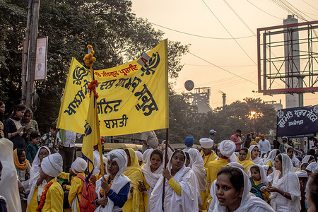 A group of Sikh children in traditional attire walk along a street with the Tata Steel plant during celebrations marking the 556th birth anniversary of Guru Nanak Dev Ji. Sikh devotees in Jamshedpur celebrated the 556th birth anniversary of Guru Nanak Dev Ji, the founder of Sikhism. The industrial city, home to a large Sikh community since the 1947 Partition and the 1984 anti-Sikh riots, remains an important center of Sikh faith and culture.