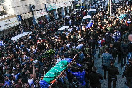 (EDITOR'S NOTE: Image depicts death)
Mourners and gunmen carry the bodies of the four Palestinians who were shot dead by Israeli special forces in the city of Jenin in the occupied West Bank. An Israeli special force infiltrated the middle of the market in the city of Jenin and shot dead 4 Palestinians.