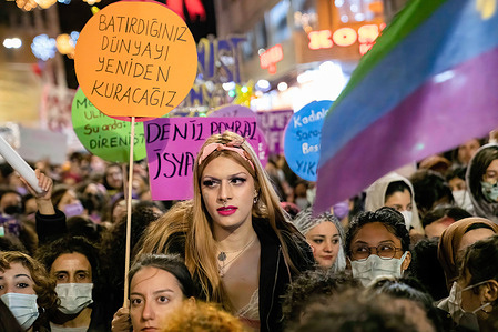 Protesters are seen holding placards and the pride flag holds a placard during the demonstration.
Thousands of women gathered along Istiklal Street in Istanbul to commemorate the International Day for the Elimination of Violence against Women. Police used force and threw tear gas to disperse demonstrators.