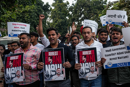 Activists of Indian Youth Congress Party (IYC), hold placards and shout slogans during a protest demanding the arrest of billionaire Indian tycoon Gautam Adani, over corruption allegations by US prosecutors. Billionaire Gautam Adani, whose business empire has been rocked by US bribery charges, is one of the corporate world's great survivors.
