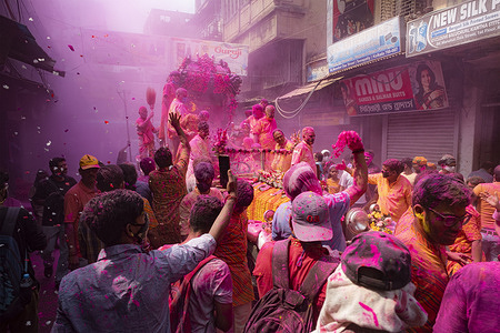 People covered in colored dye enjoying during the festival.
Holi is a popular ancient Hindu festival, also known as the "festival of love", the "festival of colours", and the "festival of spring". The festival celebrates the eternal and divine love of Radha and Krishna. It also signifies the triumph of good over evil.