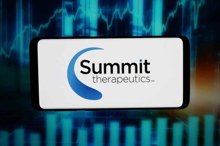 In this photo illustration, the logo of US biopharma company Summit Therapeutics Inc. is seen displayed on a smartphone in front of abstract background on computer screen.