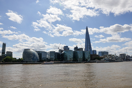 A view of The Shard and River Thames. The Shard was conceived as a building with multiple uses: a vertical city where people could live, work and relax. It comprises world-class offices, award-winning restaurants, the 5-star Shangri-La Hotel, exclusive residences and the UK's highest viewing gallery, The View from The Shard, offering 360-degree views