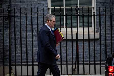 Prime Minister, Keir Starmer walks on the Downing Street before the Prime Minister's Questions in London. Prime Minister of the United Kingdom, Keir Starmer was leaving Downing Street in London to face with the Prime Minister's Questions at the House of Commons in the Parliament. Prime Minister's Questions is a weekly session where the Members of the Parliament can directly question the Prime Minister about the government policies and event.