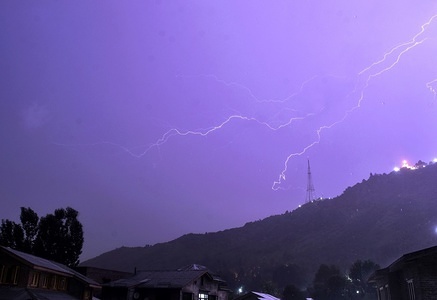 Lightning strikes early Tuesday morning over the Zabarwan hills in Srinagar, Indian administered Kashmir.