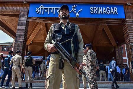 A paramilitary trooper stands alert at the Srinagar railway station during the inauguration of the Kashmir’s first all-weather rail link. Indian Prime Minister Narendra Modi opened a strategic railway project linking the Kashmir Valley to the Indian mainland by train. It was Modi's first visit to the contested region since a conflict with arch-rival Pakistan last month.
