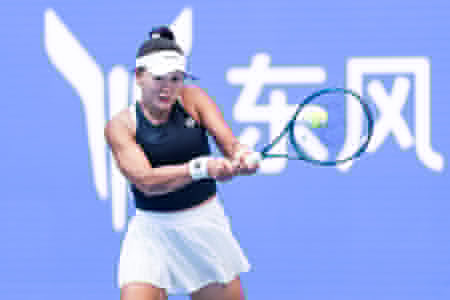 Hanyu Guo of China seen in action with Sorana Cirstea of Romania ( not in view) during the Wuhan Open final match at the Optics Valley International Tennis Center. Hanyu Guo defeated Sorana Cirstea with a score of 1-6, 7-6, 7-5.